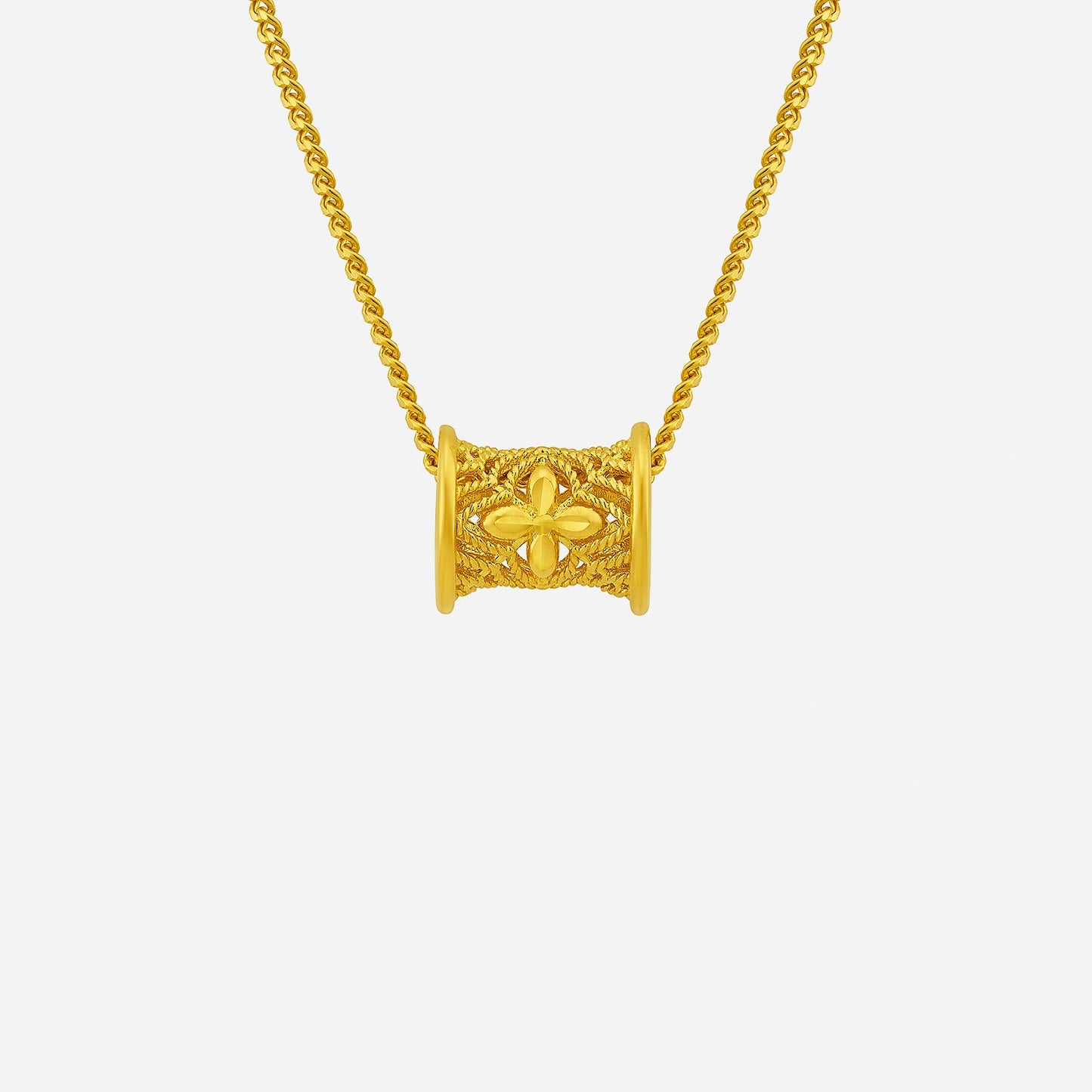 crafted cylindrical pendant in 24k yellow gold with intricate floral design, suspended on a delicate chain.