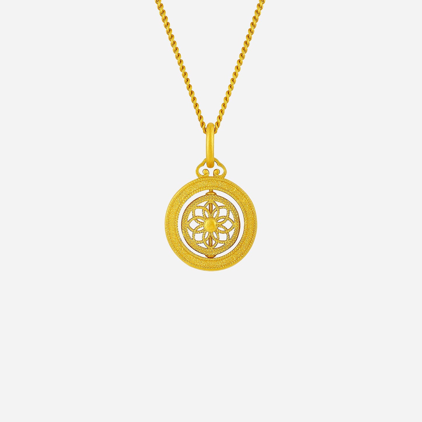 whirling petal pendant in 24k yellow gold with intricate petal motif and spinnable center, showcasing floral elegance.