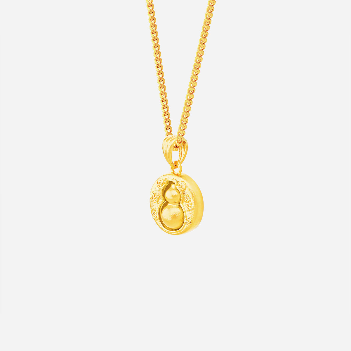 spinning gourd pendant in 24k yellow gold with intricate design and rotating feature for balance and abundance.