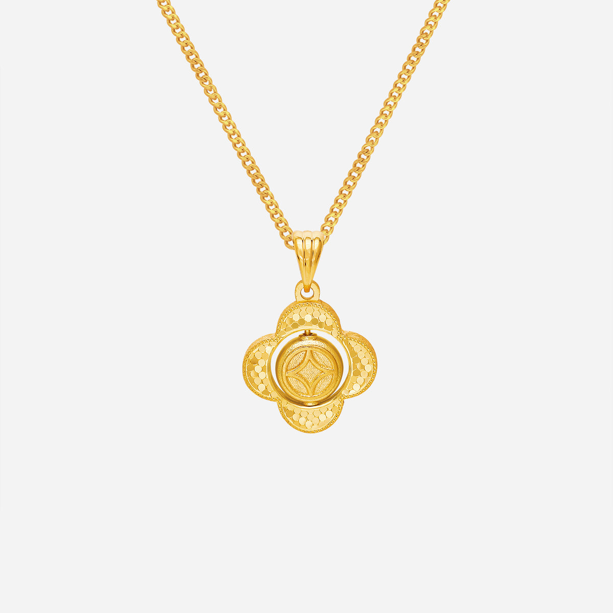 24k yellow gold spinning prosperity pendant featuring a central spinning coin in a clover frame design.