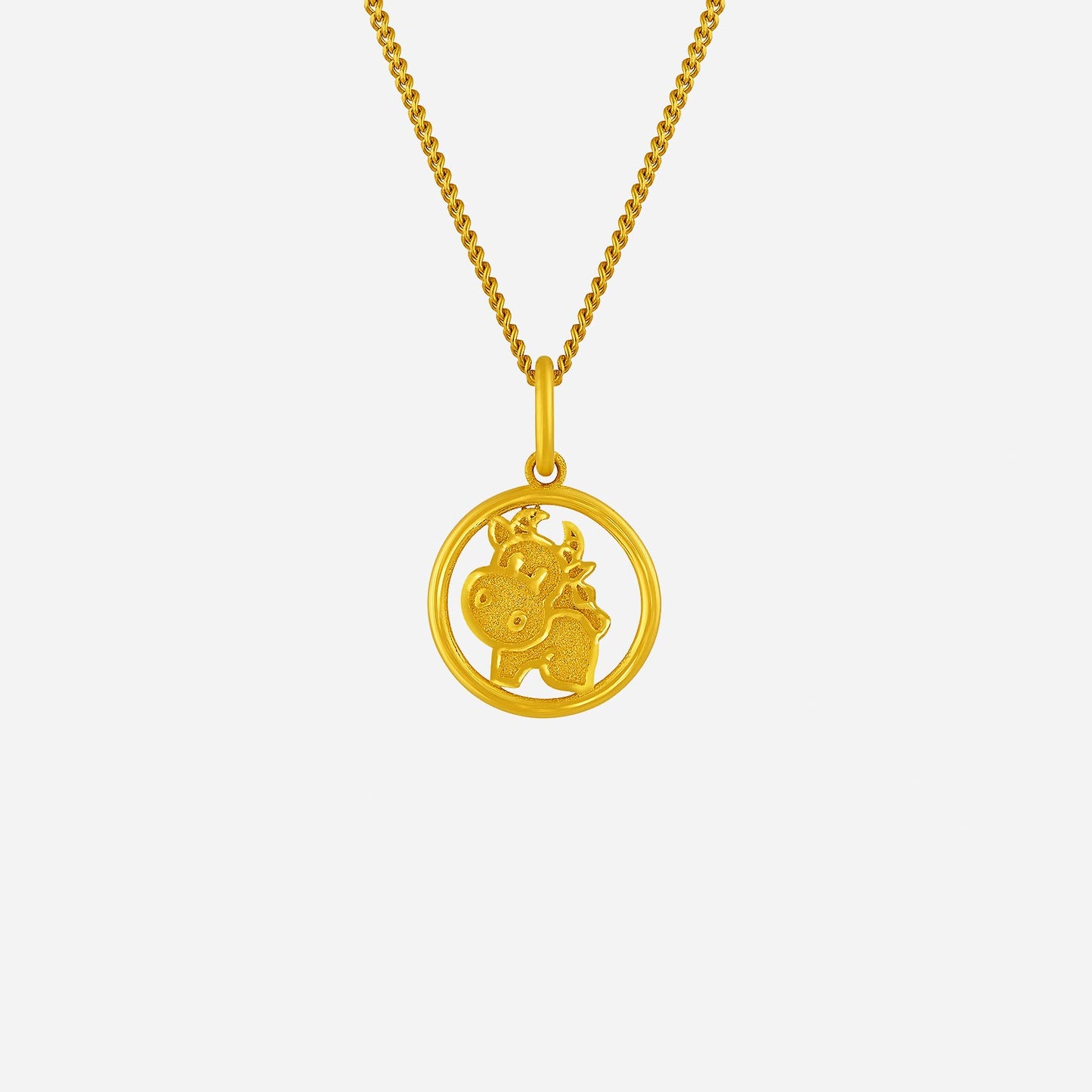 harmonies of joy ox pendant crafted in 24k yellow gold with intricate ox design within a circular frame.
