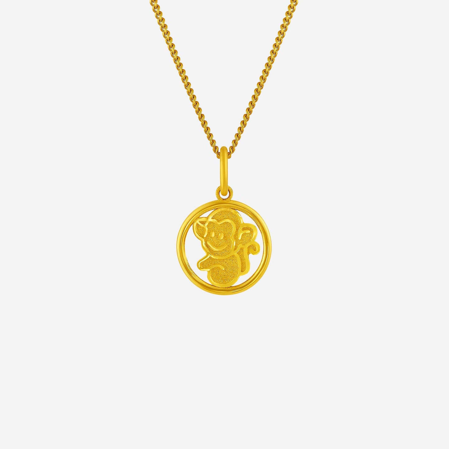 harmonies of joy monkey pendant in 24k yellow gold with playful monkey design inside circular frame.