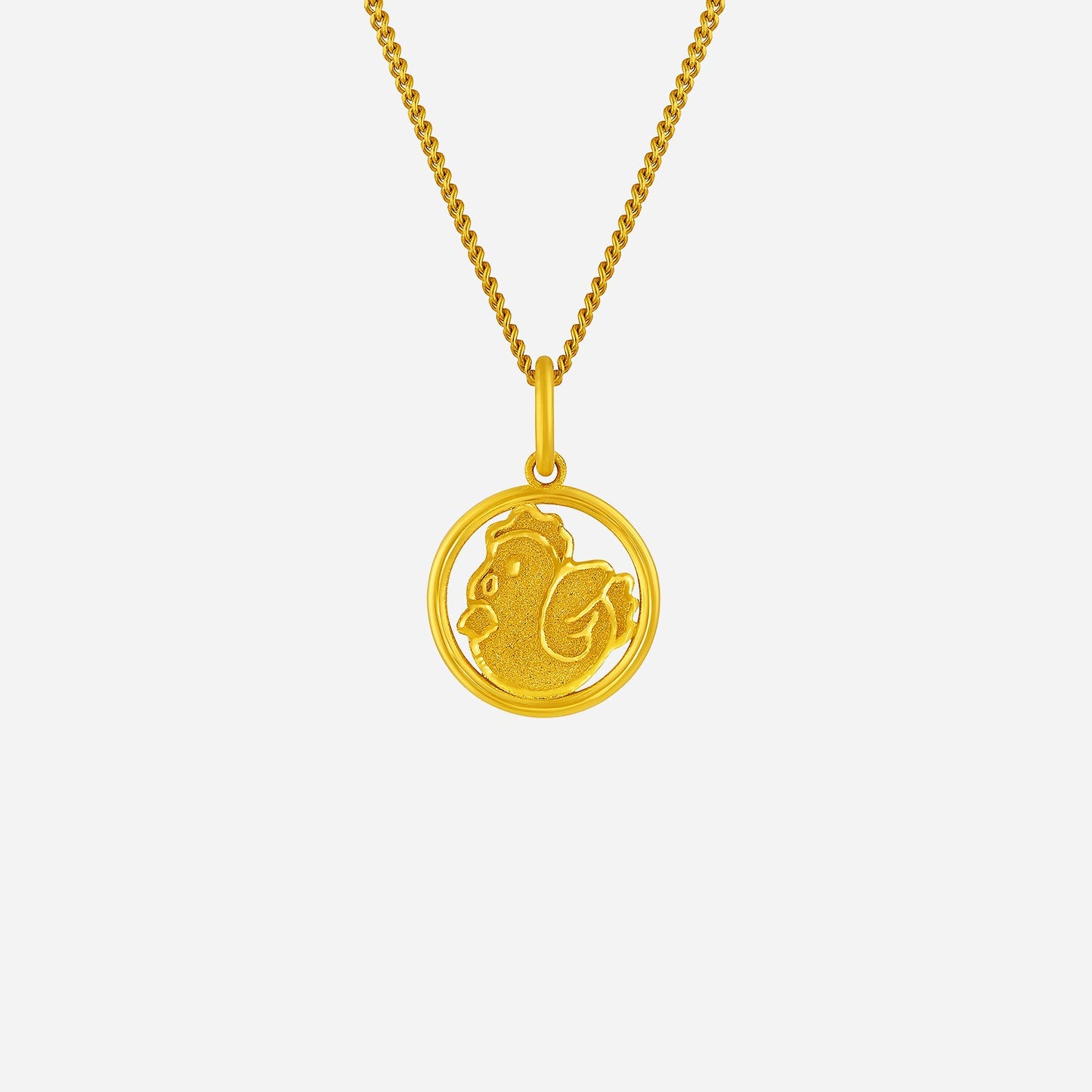 harmonies of joy rooster pendant in 24k yellow gold with a detailed rooster design in a circular frame.
