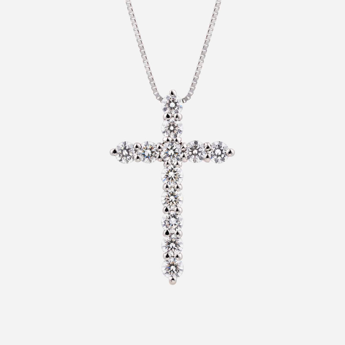 cross pendant made of 18k white gold, adorned with sparkling diamonds, featuring a classic cross design.