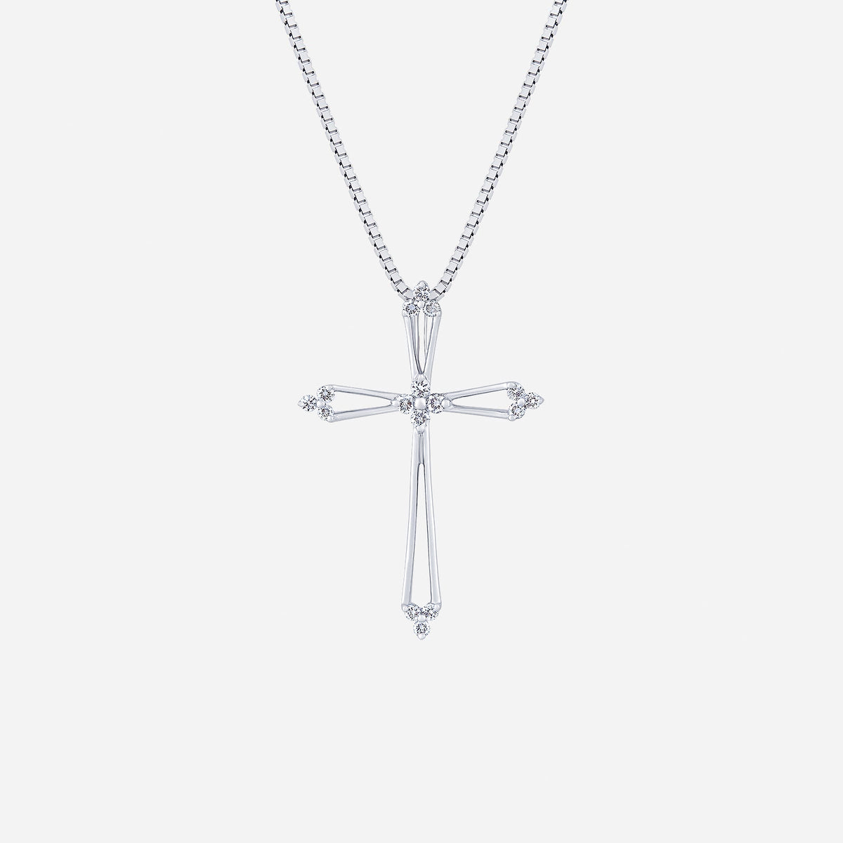 cross diamond pendant in 18k white gold with clear gemstones, featuring a minimalist design and delicate chain.