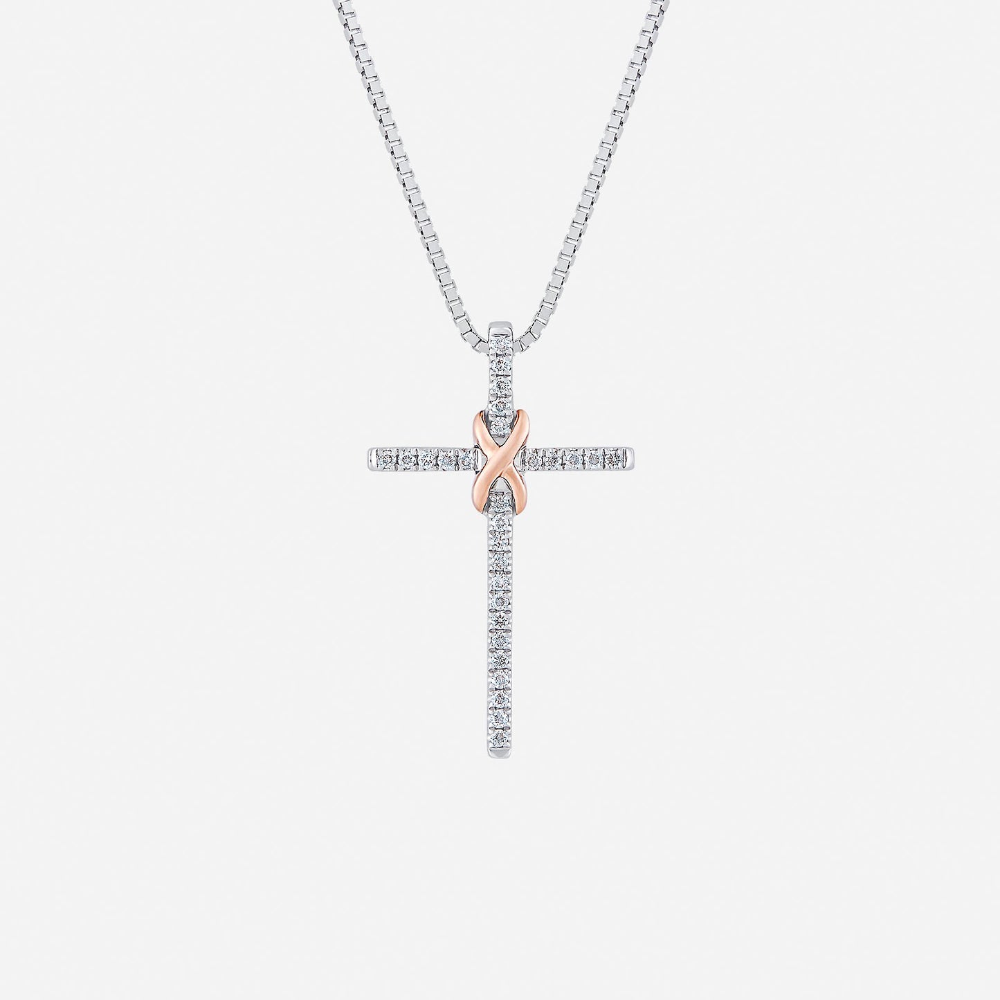 cross pendant in 18k white and rose gold with pavé-set diamonds and polished rose gold knot design.