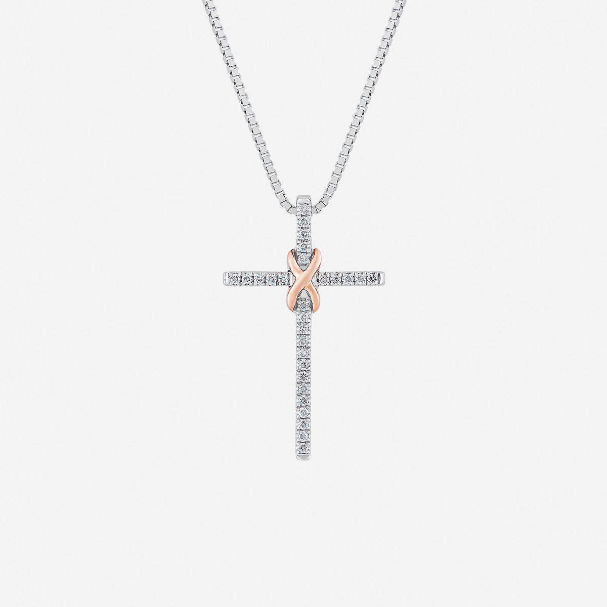 cross diamond pendant in pavé-set 18k white and rose gold, featuring a polished knot design. elegant and symbolic.