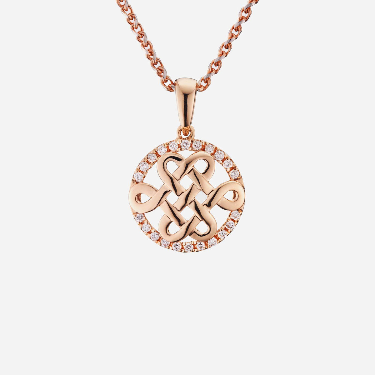 eternity knot pendant in 18k rose gold, framed with sparkling diamonds in a circular design.