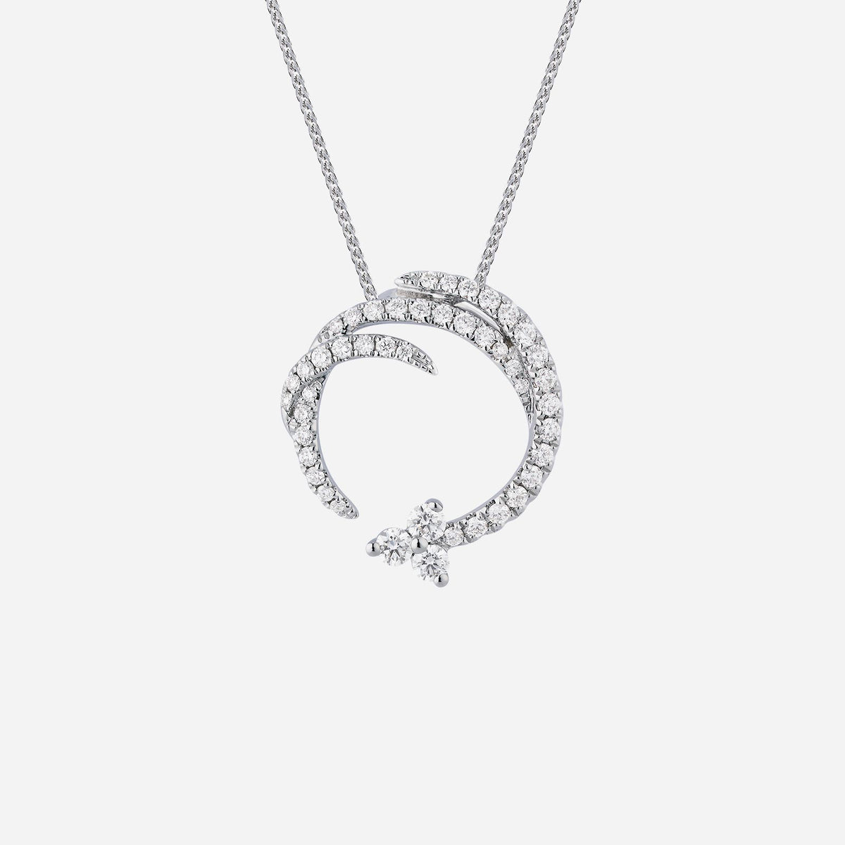 timeless diamond pendant in 18k white gold featuring modern circular design with three diamonds.