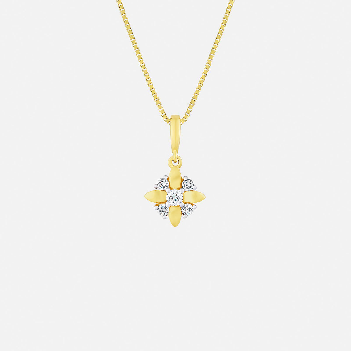 starburst diamond pendant in 18k yellow and white gold with sparkling diamonds in a floral design.