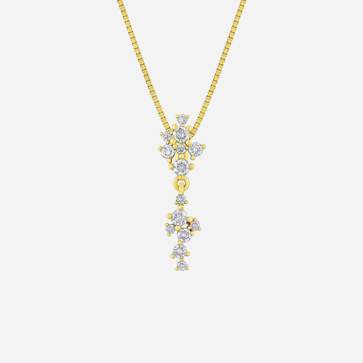 asterism diamond pendant in 18k yellow gold, featuring a delicate cascade of round diamonds and polished gold beads.