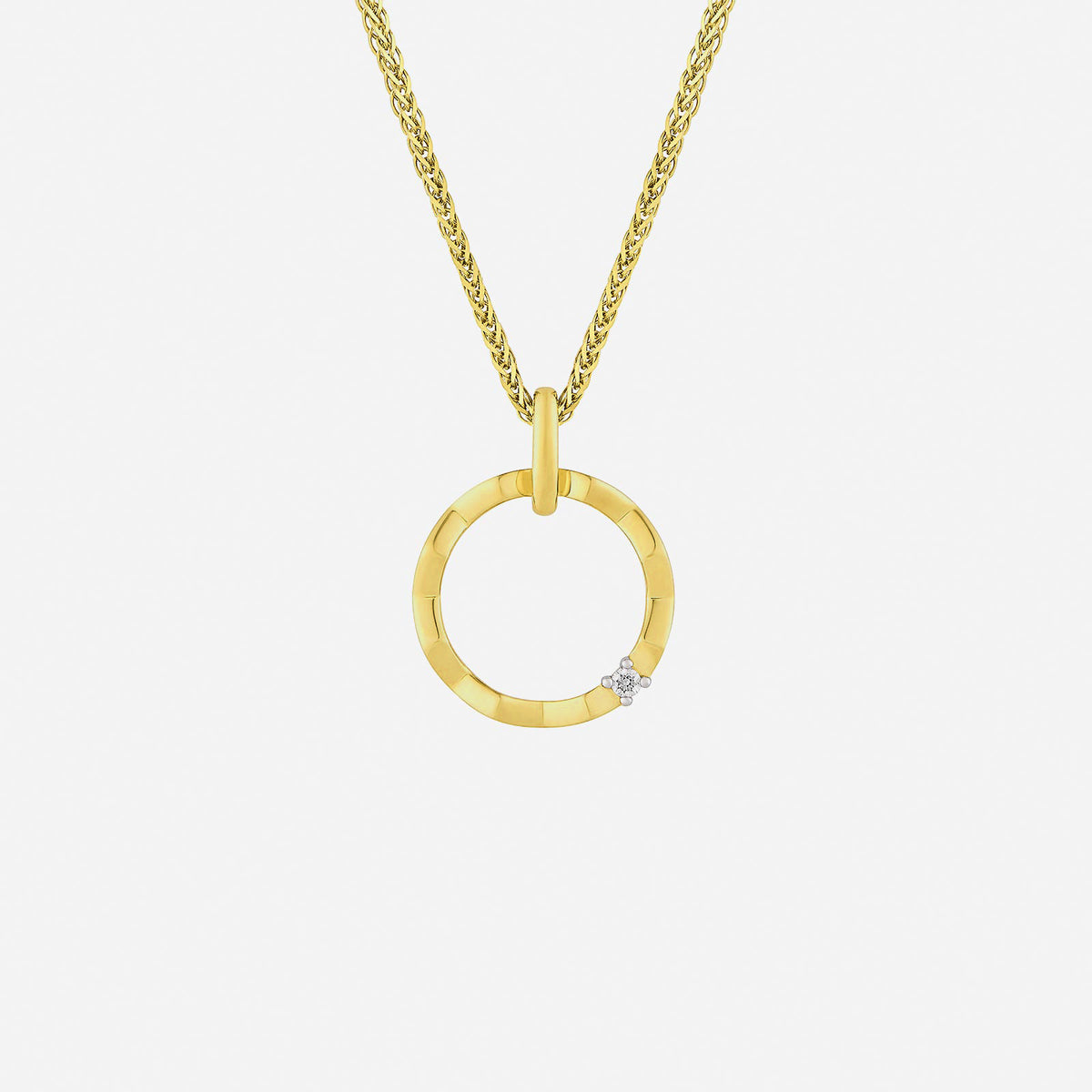 faceted diamond pendant in 18k yellow and white gold, featuring a soft circular design with delicate diamonds.