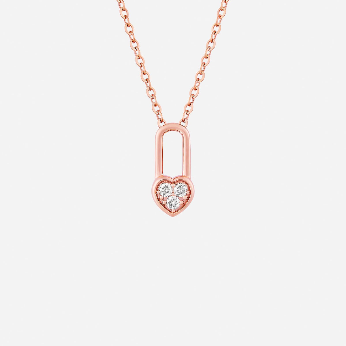 lock of love diamond pendant in 18k rose gold featuring a heart silhouette with three sparkling diamonds.