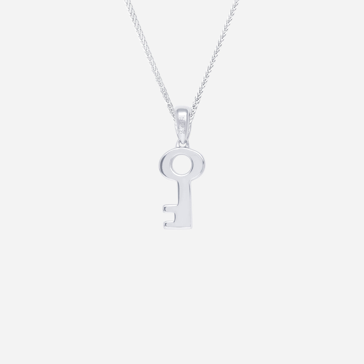 key pendant in 18k white gold featuring a minimalist key design with a smooth, polished finish.