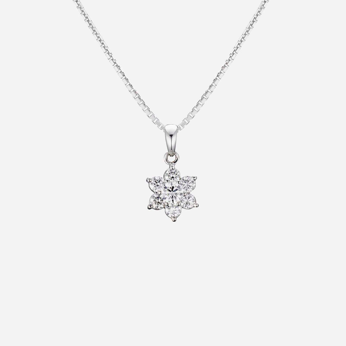 blossom diamond pendant in 18k white gold featuring a flower design adorned with 7 sparkling diamonds.