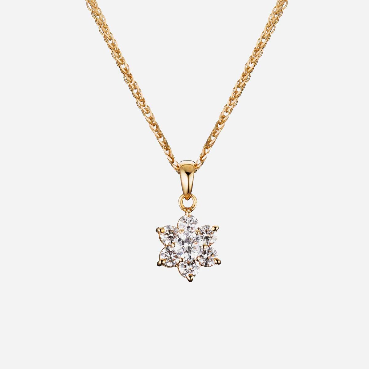 blossom pendant in 18k yellow gold with six brilliant diamonds surrounding a solitaire gemstone.