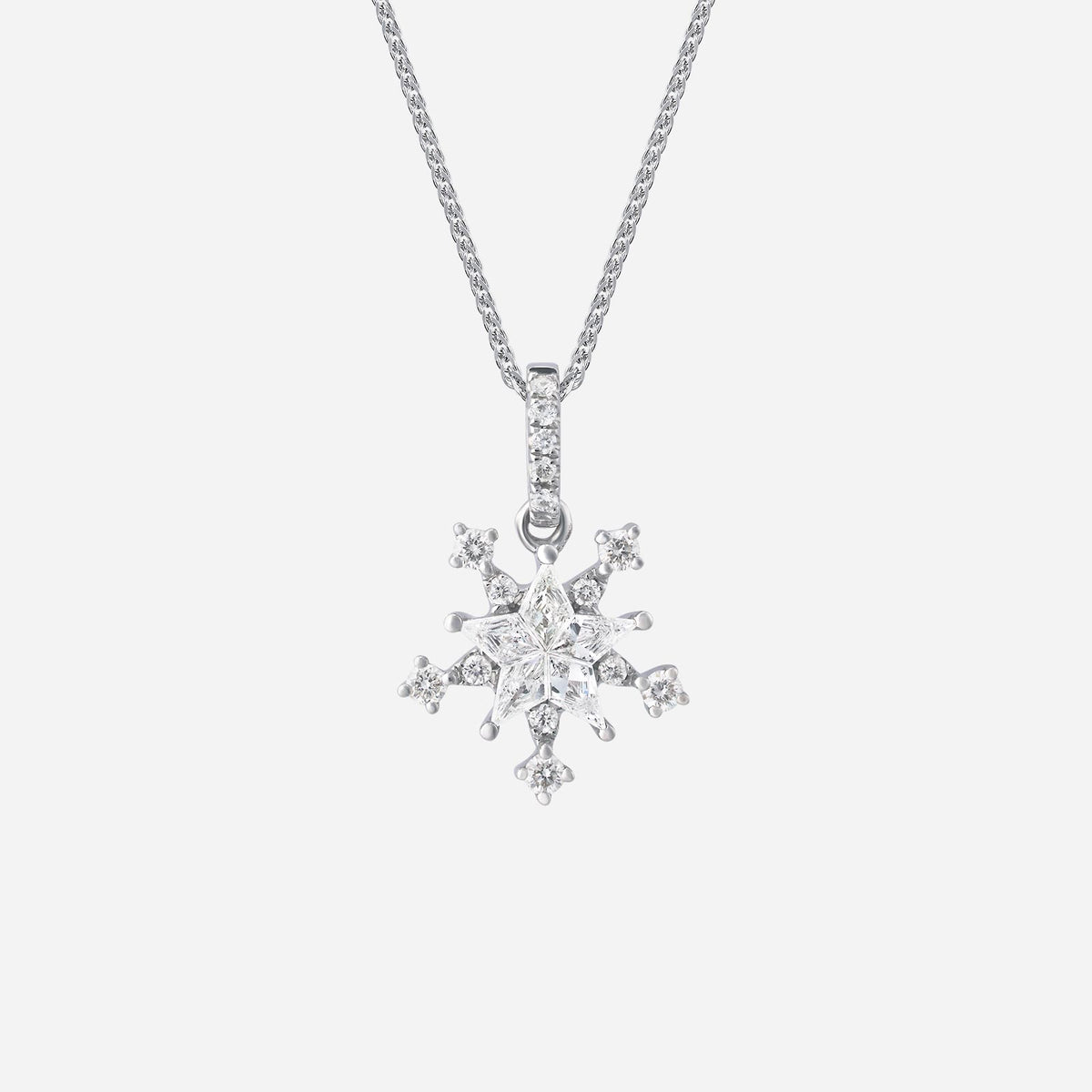snowflake diamond pendant in 18k white gold with intricate snowflake design and sparkling diamonds.