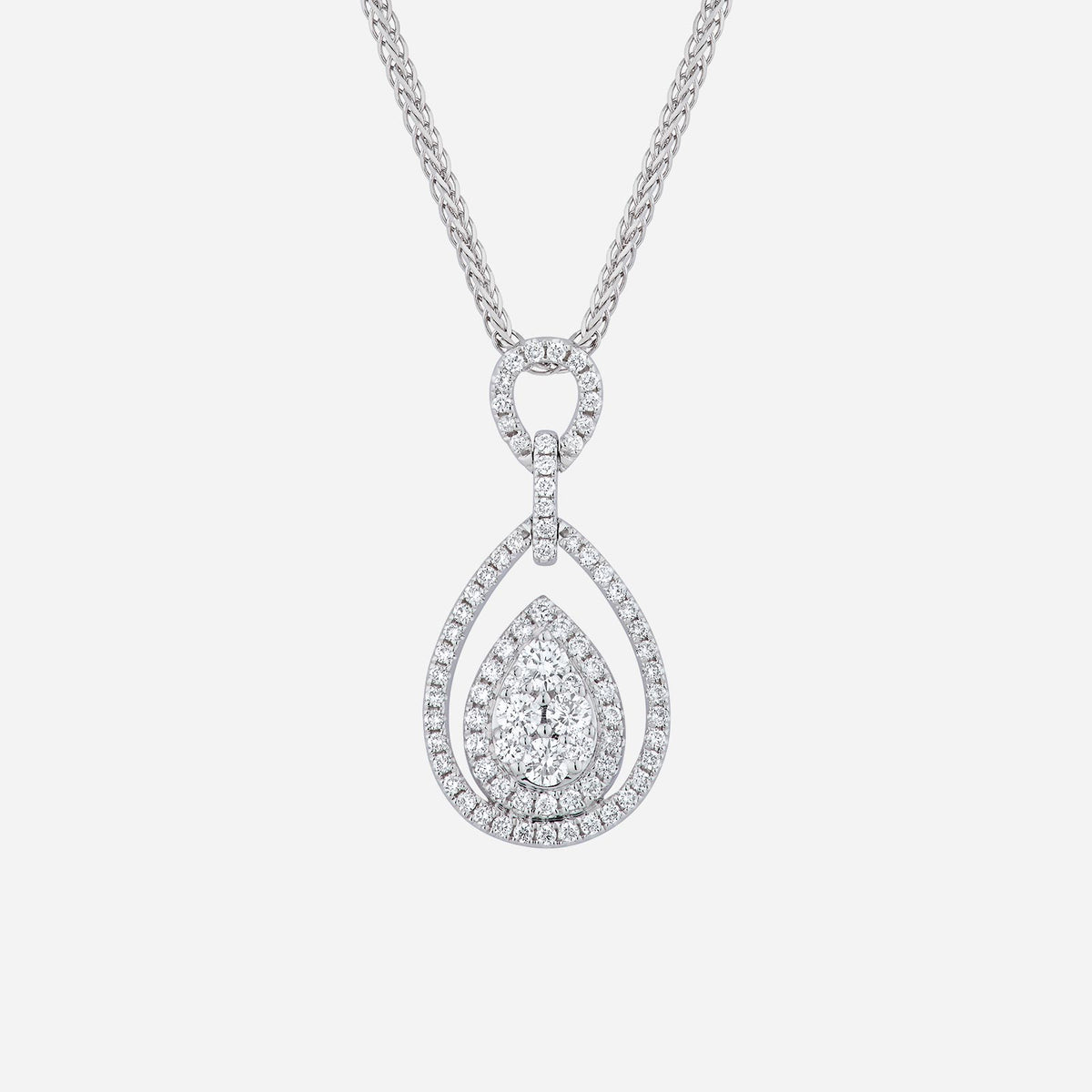 pear halo diamond pendant in 18k white gold, featuring pear-shaped diamond center with smaller diamonds in a halo design.