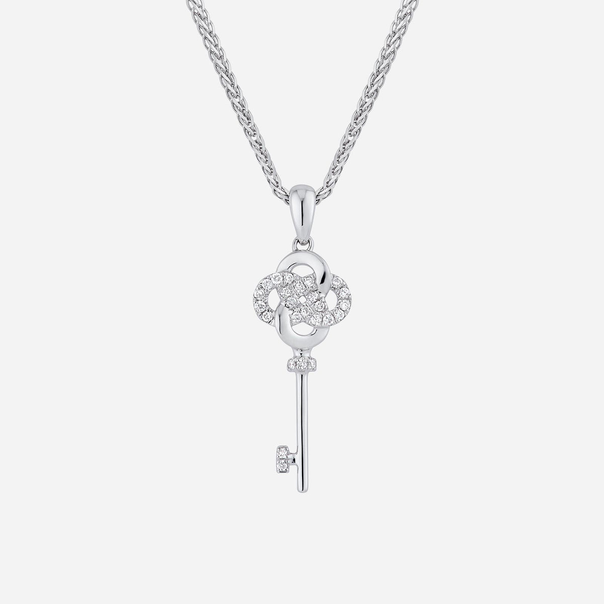 eternity key pendant in white gold, featuring dazzling diamonds and intricate knot design symbolizing timeless beauty.