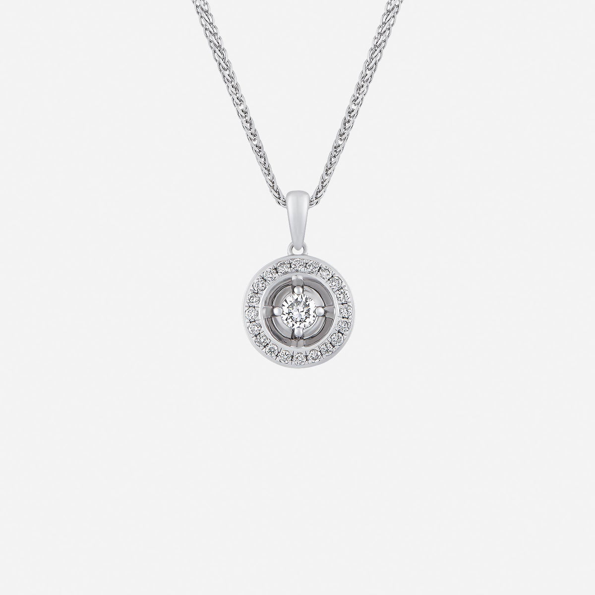 halo diamond pendant in 18k white gold featuring a center diamond surrounded by smaller diamonds.