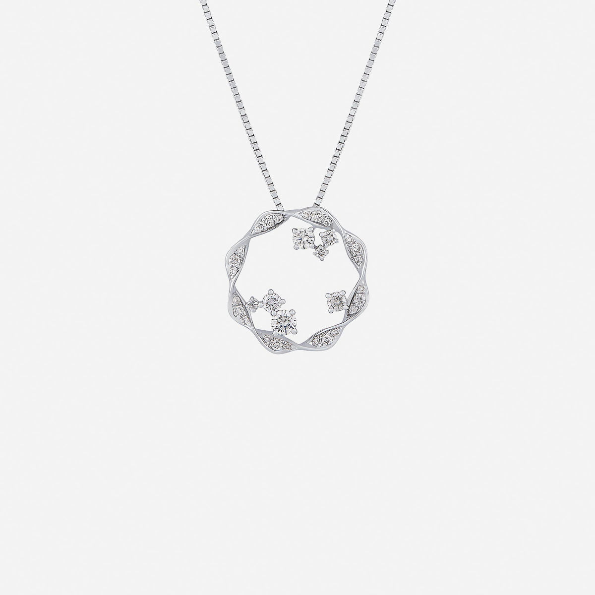 flora aura diamond pendant in 18k white gold featuring twisting floral motifs and sparkling diamond accents.