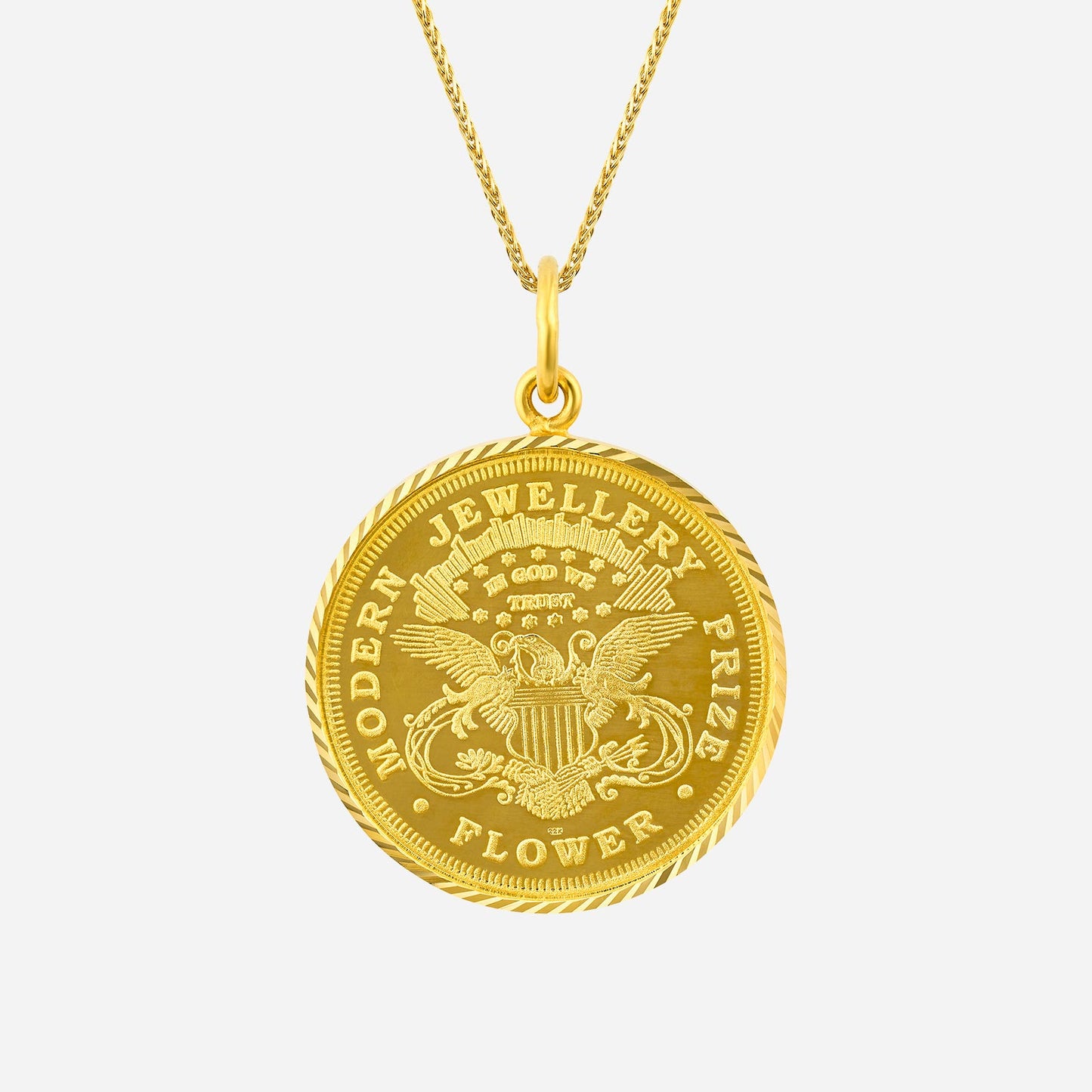 intricate 22k yellow gold lady liberty pendant with a detailed medallion design and rope edge.
