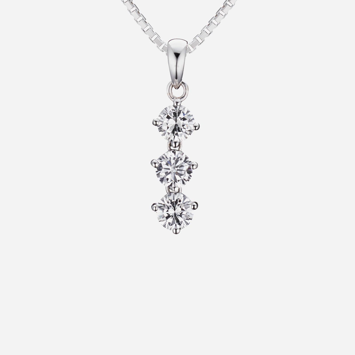 trio diamond pendant in 18k white gold featuring three round brilliant diamonds, each 0.10 carat, elegantly linked.