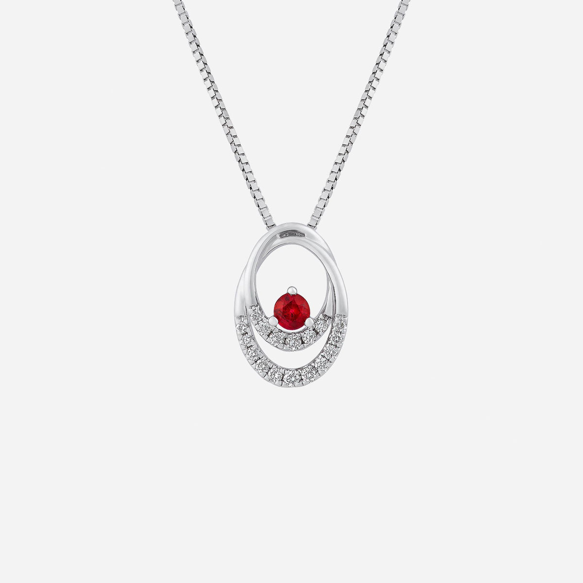 ovate ruby pendant in 18k white gold, surrounded by sparkling diamonds, elegant and sophisticated design.