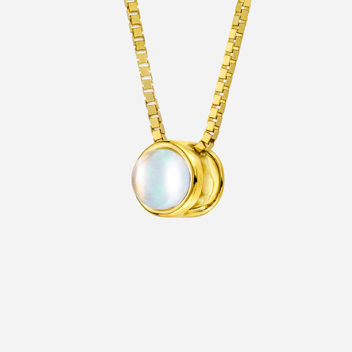 moonstone pendant in 18k yellow gold with luminous cabochon design, featuring shimmering bluish light.