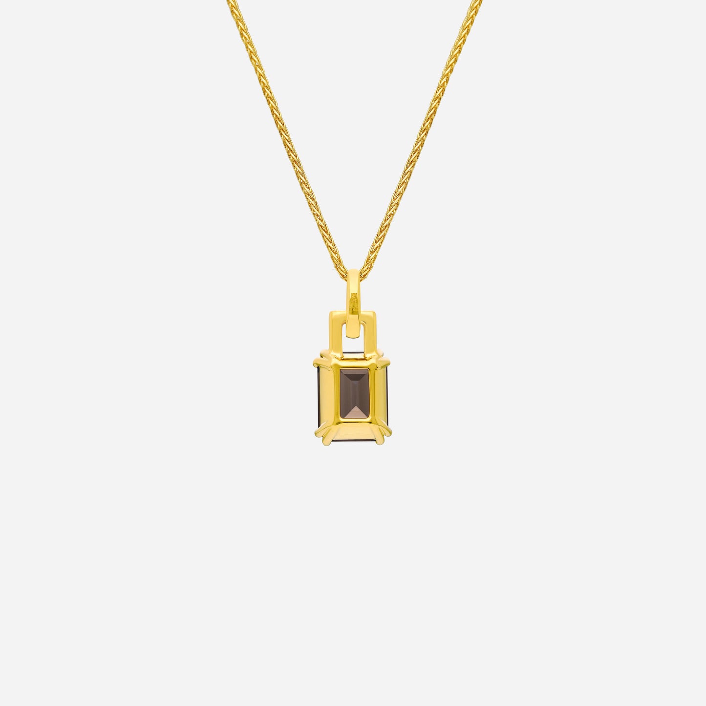 luxe pendant featuring a smoky quartz gemstone and diamond accents set in 18k yellow gold. elegant and refined design.