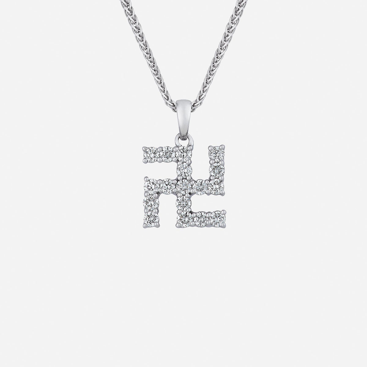 swastika diamond pendant in 18k white gold with sparkling diamonds showcasing a traditional design. chain not included.