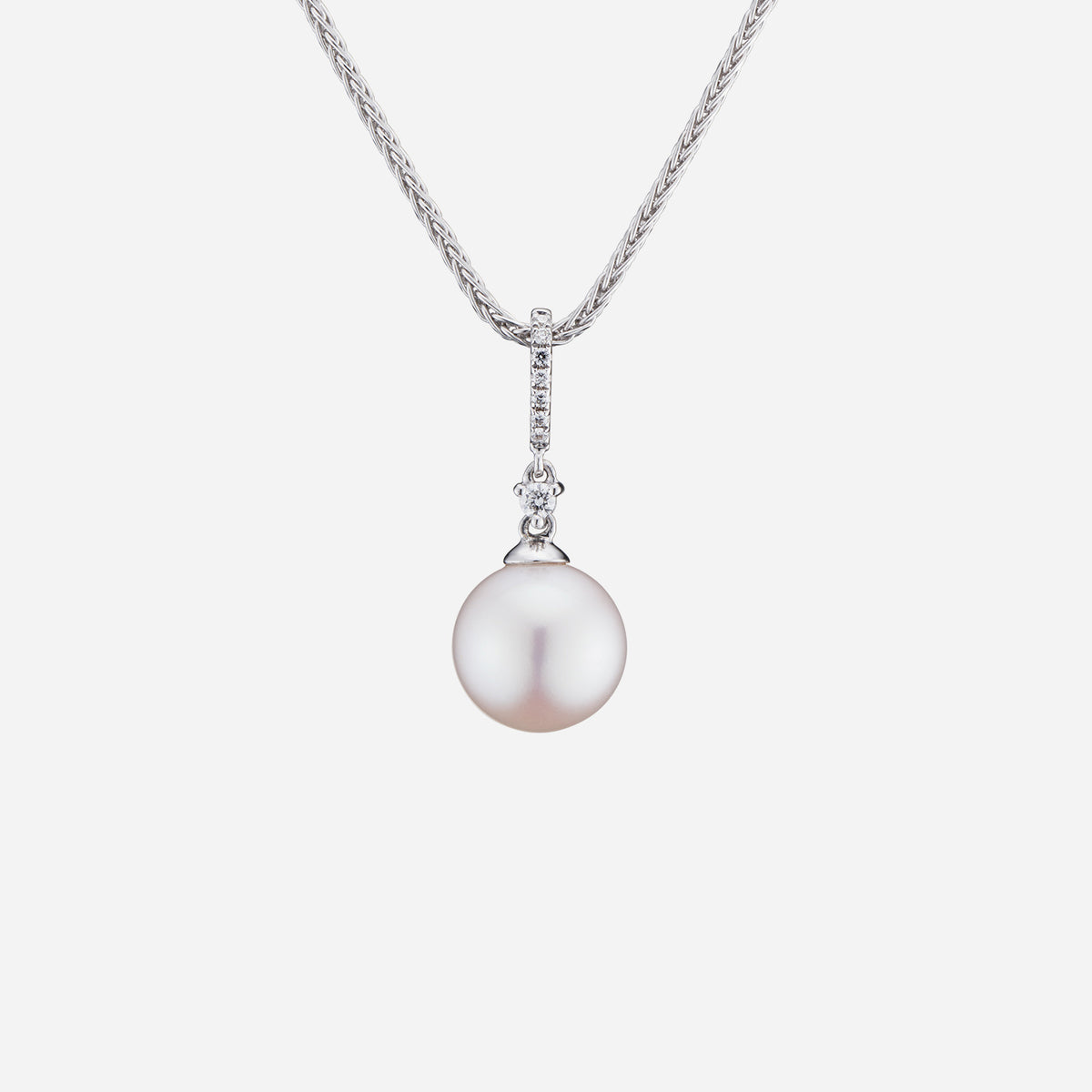 freshwater pearl pendant in diamond-studded 18k white gold, showcasing a 9mm iridescent pearl and elegant design.