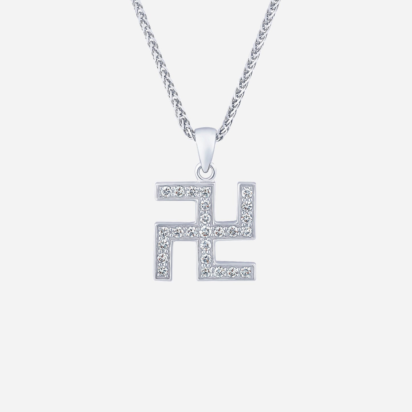 swastika pendant in white gold adorned with sparkling diamonds, showcasing a contemporary design.