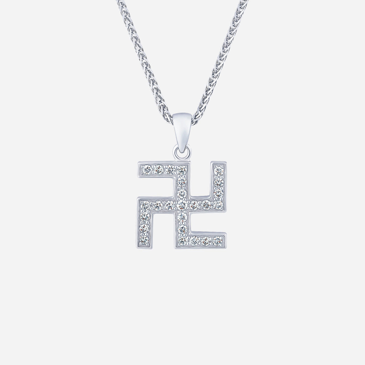swastika pendant in white gold featuring sparkling diamonds, symbolizing good luck and prosperity.