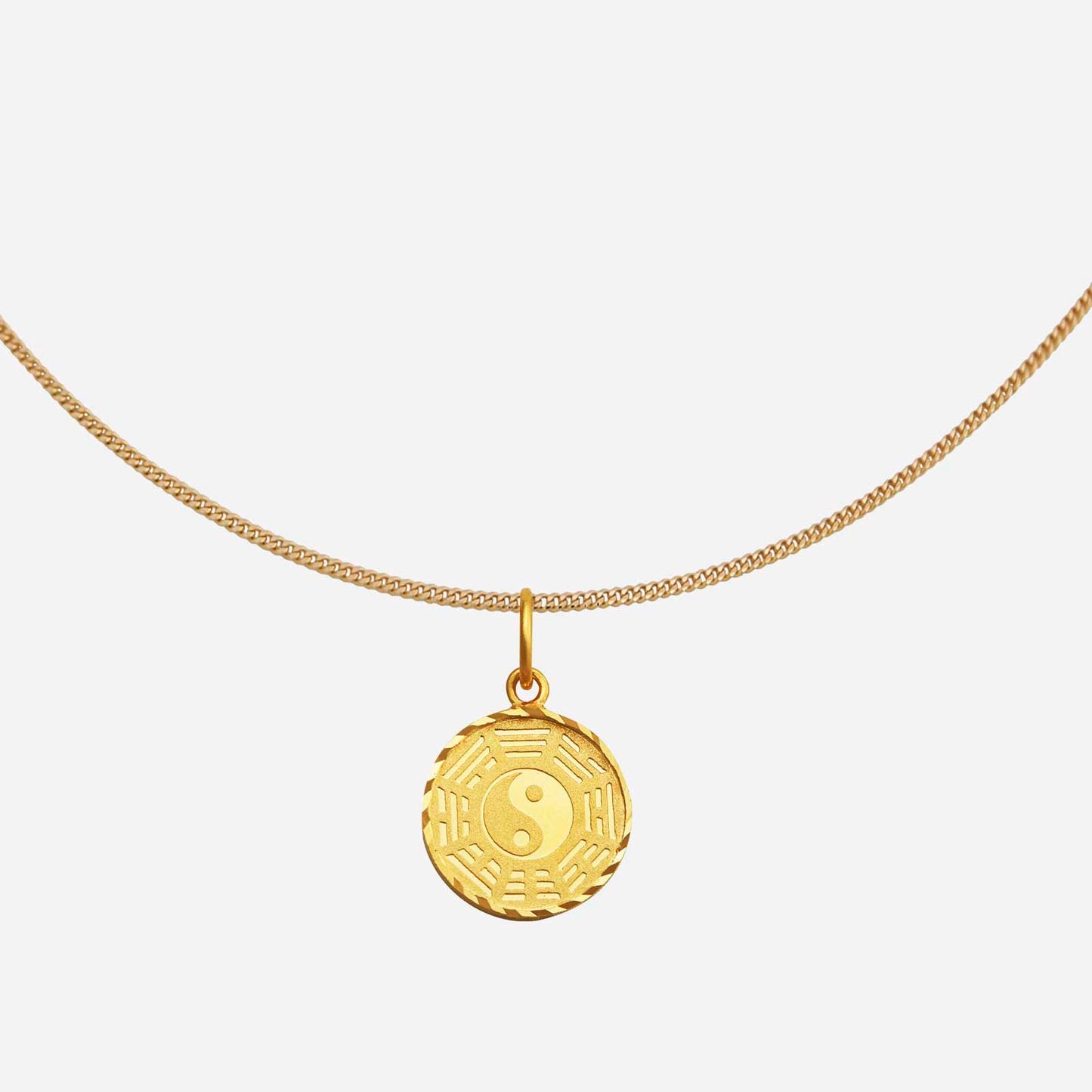 yin yang pendant in 22k yellow gold featuring intricate detailing and a symbol of balance and harmony.