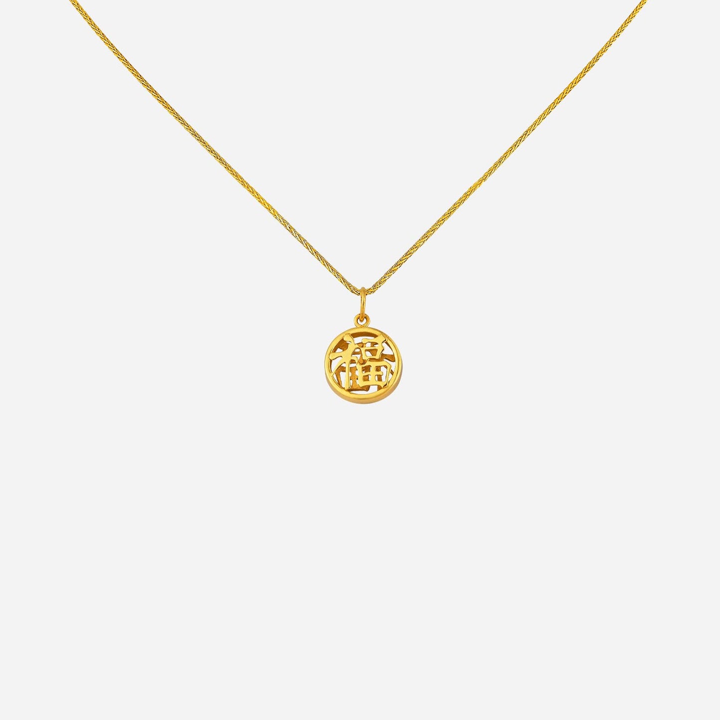22k yellow gold auspicious pendant featuring a round design with intricate symbol detail. chain sold separately.