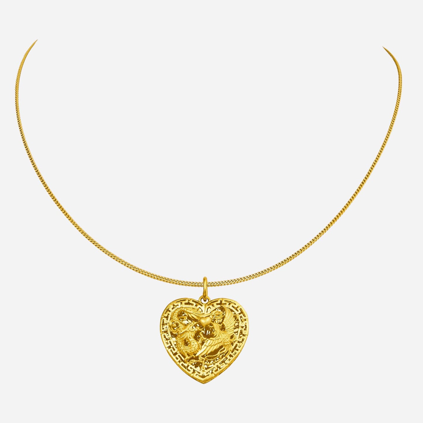 heart-shaped si dian jin pendant in 24k yellow gold featuring a dragon and phoenix design. chain not included.