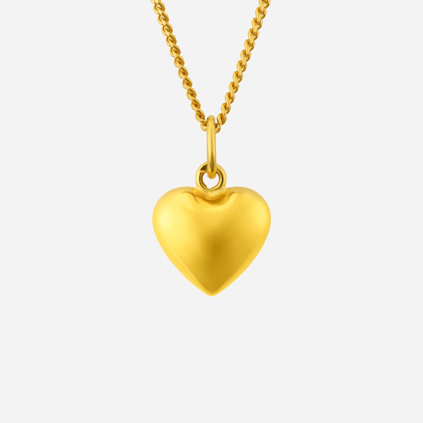 heart pendant in 22k yellow gold, featuring a smooth, polished finish and attached to a delicate chain.