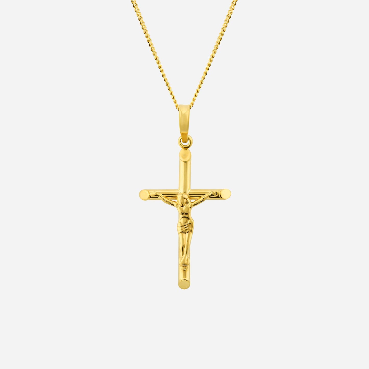 crucifix pendant in 22k yellow gold with a detailed figure, a timeless symbol of faith and hope. chain not included.