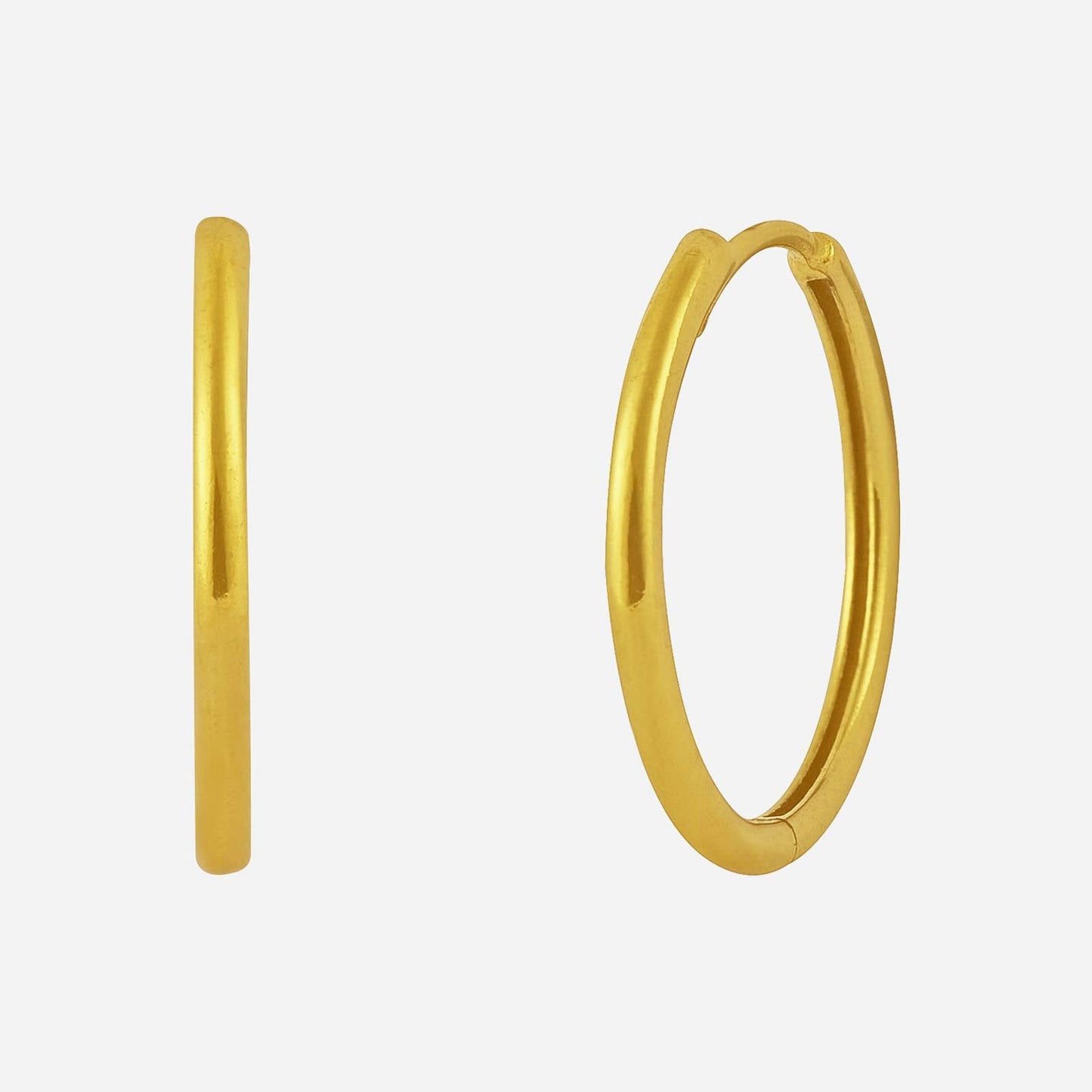 slim 22k yellow gold huggie earrings with a sleek design, offering a feminine touch and understated elegance.