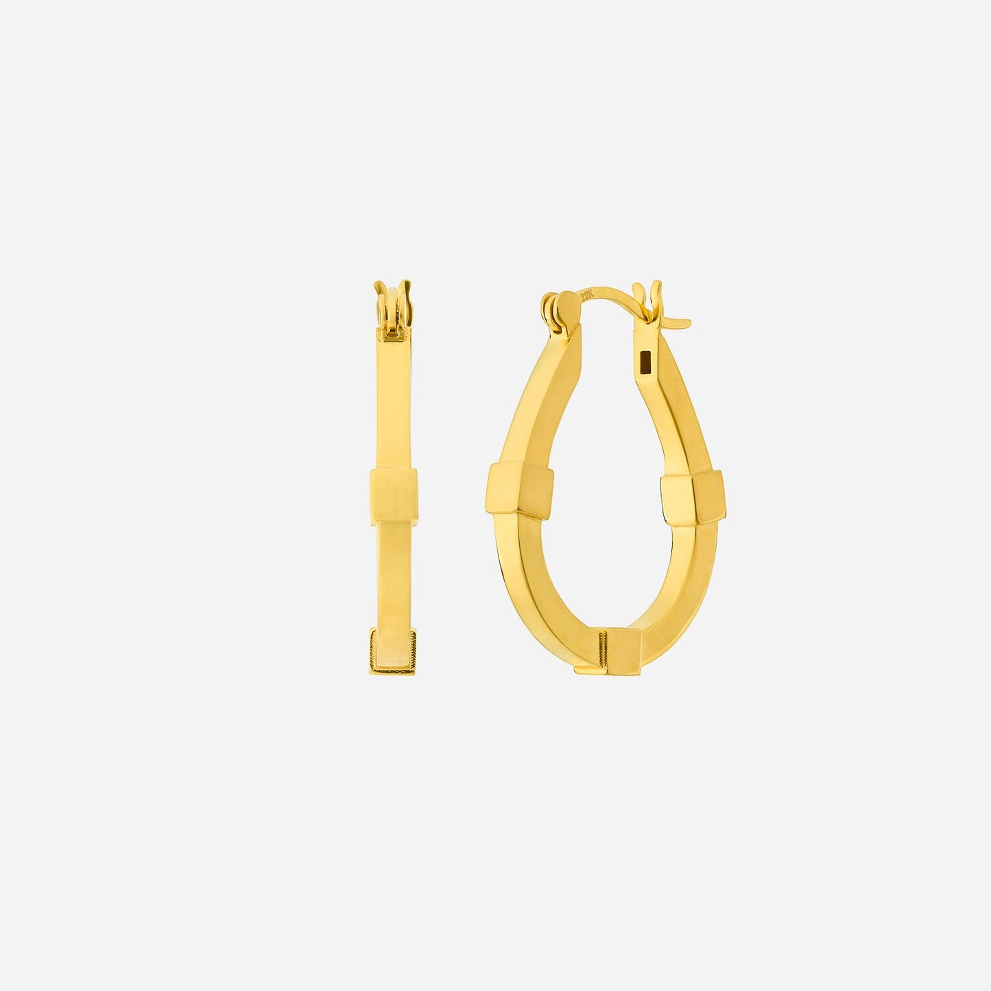 oval hoop earrings in 22k yellow gold with a modern design and textured accents, showcasing a timeless silhouette.