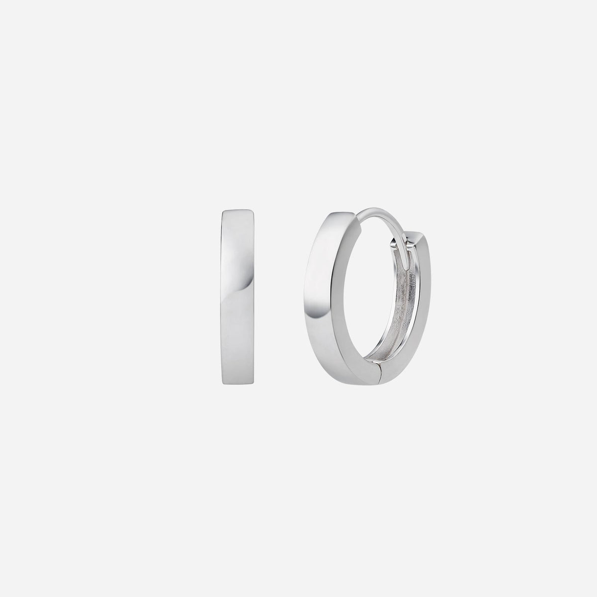 huggie earrings in 18k white gold with a sleek, minimalist design, perfect for any outfit.