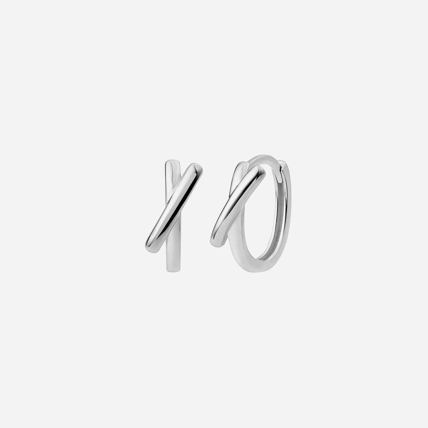 criss cross huggie earrings in 18k white gold, featuring elegant intersecting designs for a modern look.