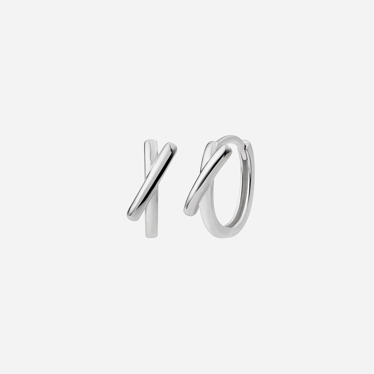 criss cross huggie earrings in 18k white gold with elegant intersecting lines symbolizing connection.