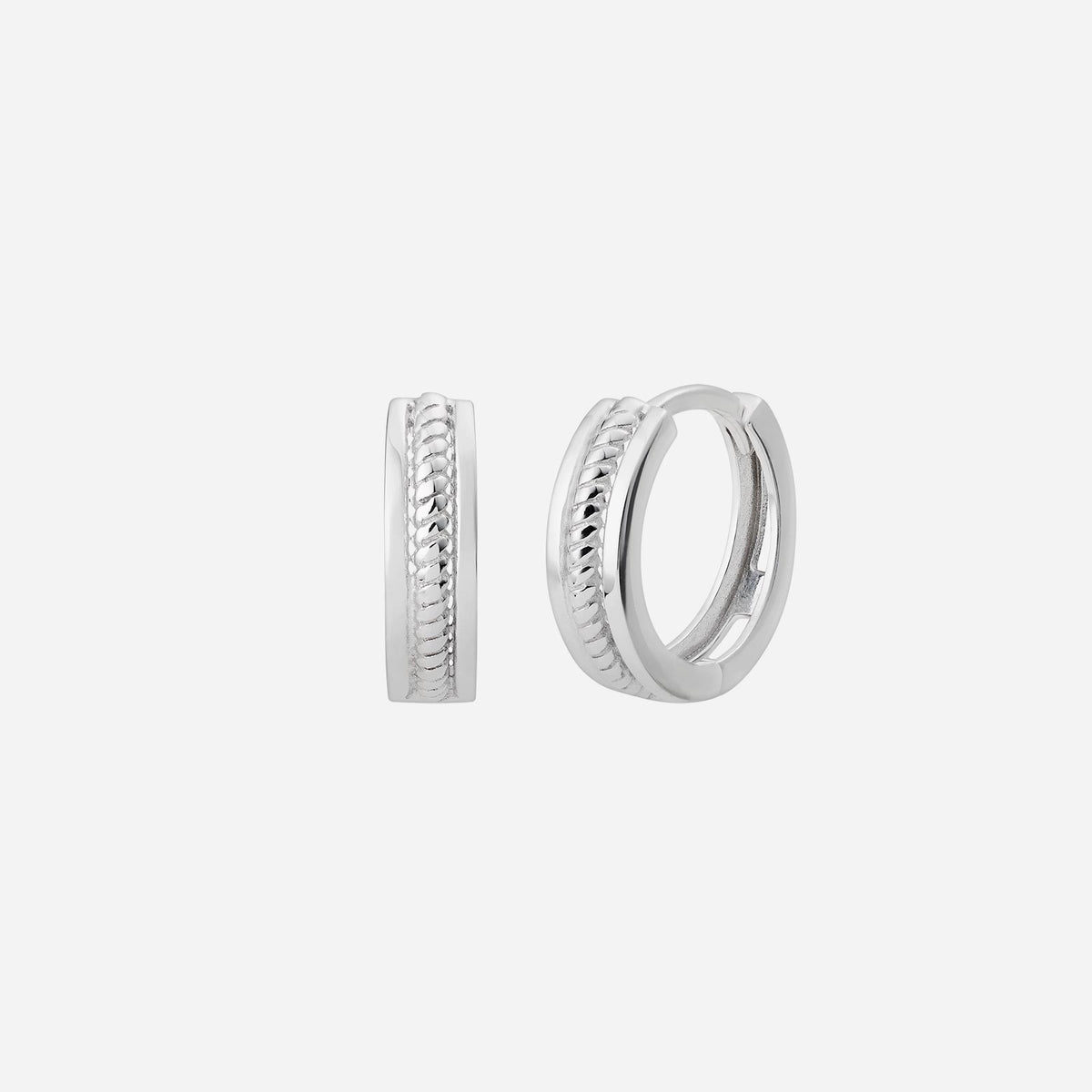 twist huggie earrings in 18k white gold featuring a unique twisted design for elegant, versatile wear.