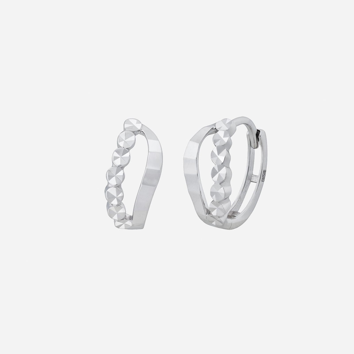 18k white gold earrings featuring a dynamic design with polished surfaces and rounded accents for a fashionable look.