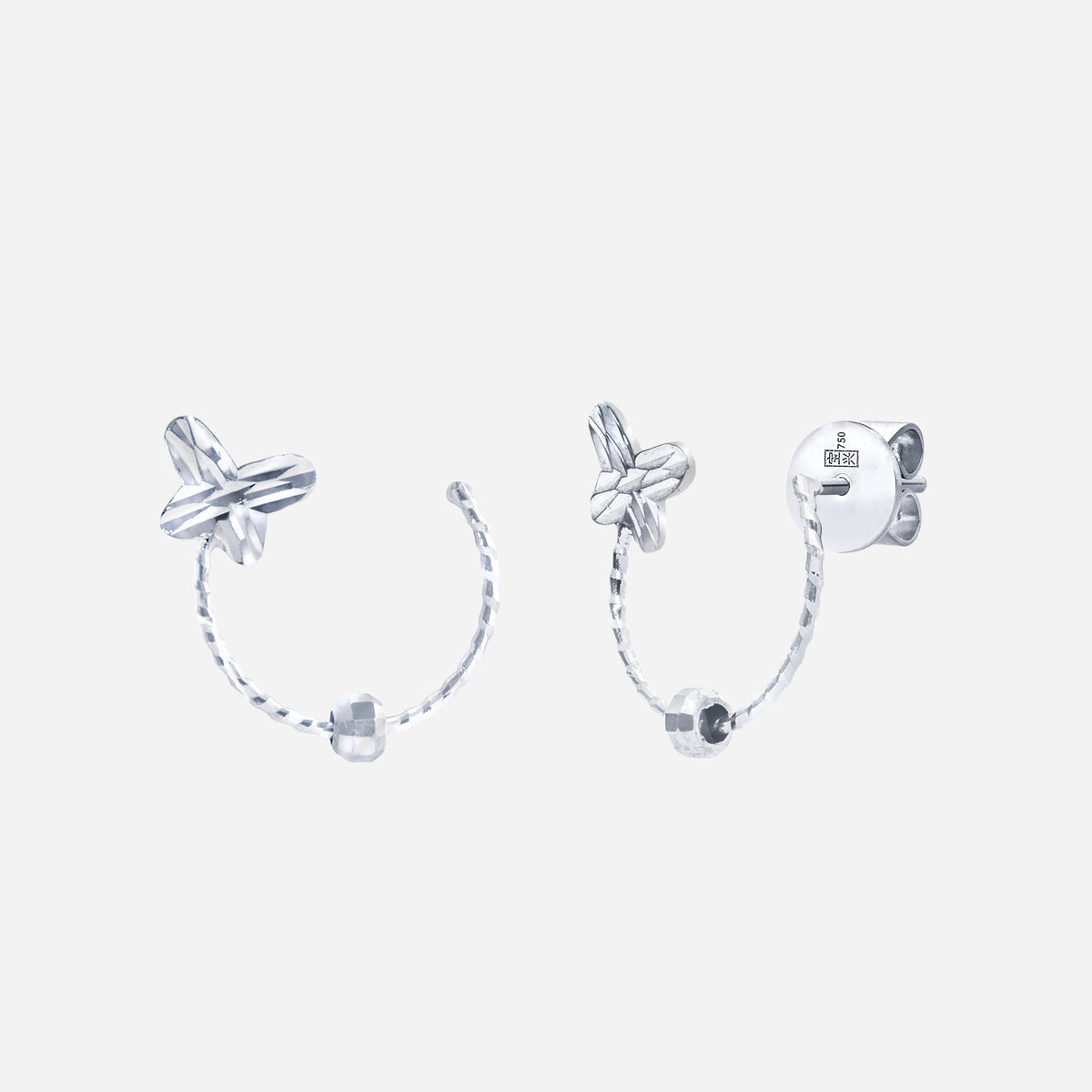 whisper wings earrings in 18k white gold featuring sculpted butterfly design with sleek open hoops.