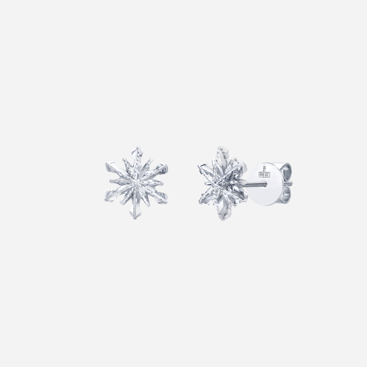 snowflake earrings in 18k white gold with intricate facets and a sparkling design, capturing winter beauty.