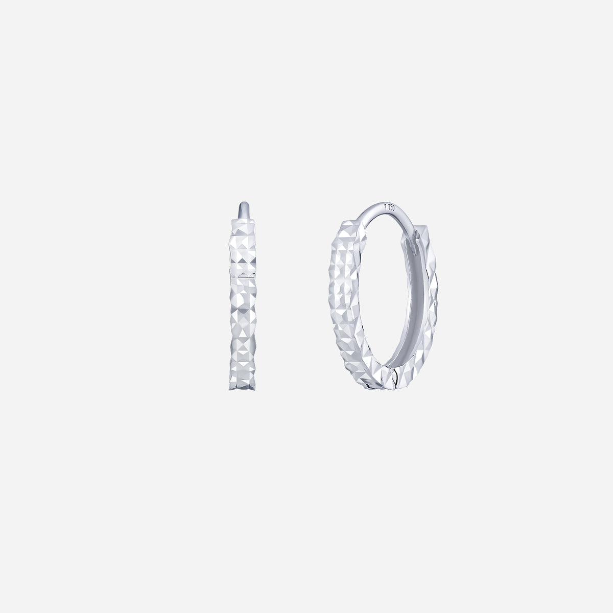huggie hoop earrings in 18k white gold with faceted surfaces for a striking textural effect. contemporary design.