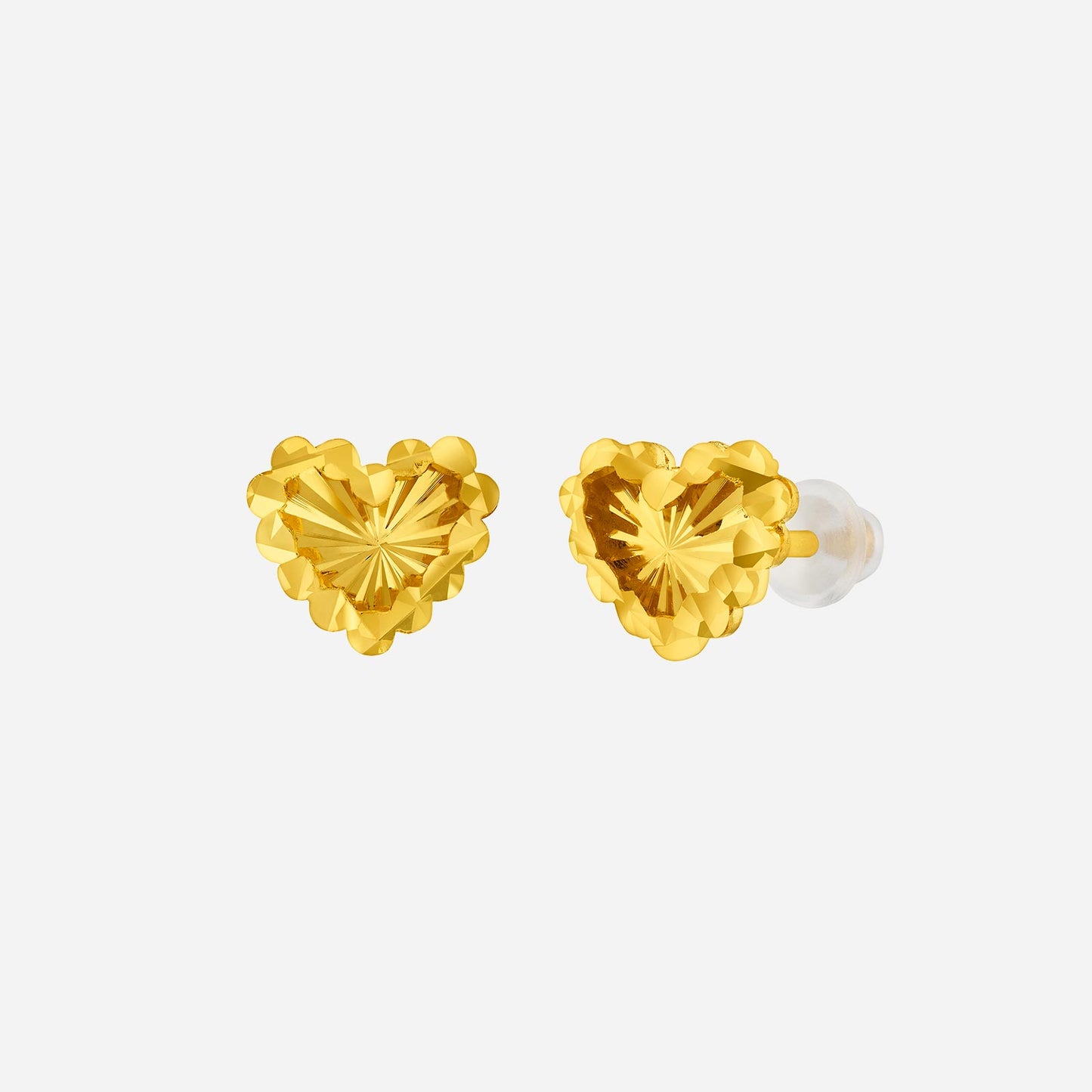 classic heart earrings in 24k yellow gold with a faceted design and silicone stud-stoppers for comfort.